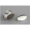 Image 1 : A George III silver oval nutmeg grater, the interior with rasp, pull-off covers engraved with flo...