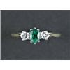 Image 1 : An 18ct gold three-stone emerald and diamond ring, - An 18ct gold three-stone emerald and diamon...