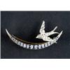 Image 1 : A sapphire and diamond crescent brooch, - A sapphire and diamond crescent brooch, c.1890, the sh...