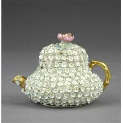 A Rockingham squat pear shaped miniature teapot and cover, - A Rockingham squat pear shaped mini...