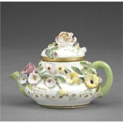 A Rockingham compressed pear shaped miniature teapot and cover, - A Rockingham compressed pear s...