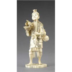 A Japanese segmental ivory figure of a gardener, - A Japanese segmental ivory figure of a garden...