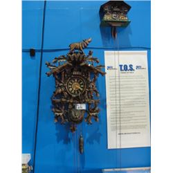 2 HEAVILY CARVED WOODEN CUCKOO CLOCKS  - BOTH CLOCKS SHOW MINOR DAMAGE