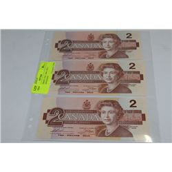 PAGE OF THREE UNC 1986 TWO DOLLAR CANADIAN