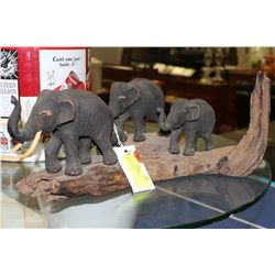 PARADE OF ELEPHANTS ON A LOG