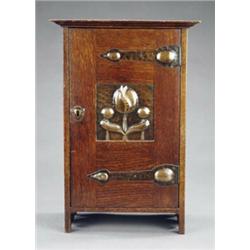 An Edwardian oak smokers cabinet, - An Edwardian oak smokers cabinet, of Art Nouveau design, the...