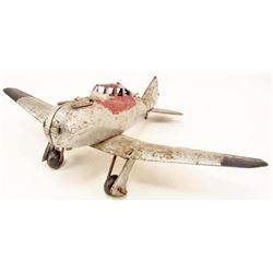 C. 1940S PRESSED STEEL FIGHTER AIRPLANE