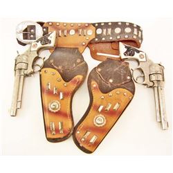 PAIR OF VINTAGE HUBLEY TEXAN JR CAP GUNS W/ HOLSTER
