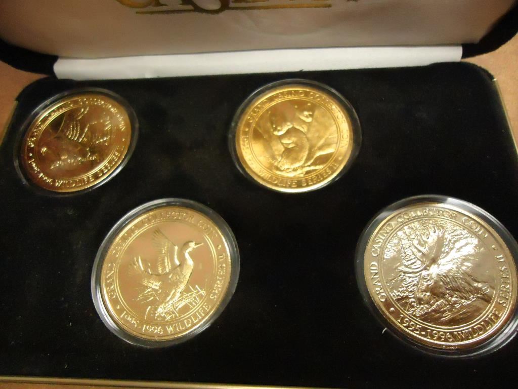 SET OF 4 GRAND CASINO GOLD PLATED COLLECTOR COINS 199596 WILDLIFE SERIES II IN NICE BLACK CASE