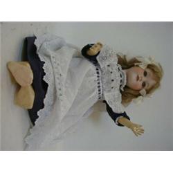 AN ARMAND MARSEILLE BISQUE HEAD DOLL, blonde wig, sleeping eyes, open mouth, jointed body, nape m...
