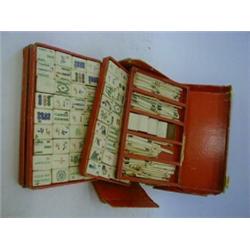 A BOXED MAH-JONG GAME, bone playing pieces, by Chad Valley, (cardboard box s.d.)  40-50...