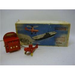 A BOXED NULLI-SECONDUS REMOTE CONTROL HELICOPTER, 1950's, red tinplate construction, with operati...
