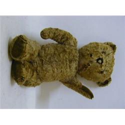 A GOLDEN PLUSH TEDDY BEAR, felt pads, musical mechanism to stomach, length 40cm, (worn)  30-40...