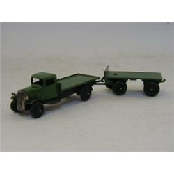 A DINKY TOYS FLAT TRUCK AND TRAILER, No.s 25c and 25g, green livery  20-30...