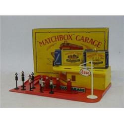 A BOXED MATCHBOX SHOWROOM AND SERVICE STATION, with accessory packs A1 (petrol pump set) and A4 (...