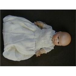 AN ARMAND MARSEILLE BISQUE HEAD BABY DOLL, sleeping eyes, closed mouth, cloth body, linen costume...