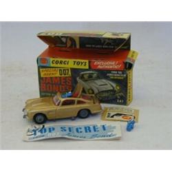 A BOXED CORGI TOYS JAMES BOND ASTON MARTIN DB5, No.261, from 'Goldfinger', gold livery, three fig...