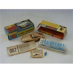 A BOXED CORGI TOYS JAMES BOND ASTON MARTIN DB5, No.261, from 'Goldfinger', gold livery, three fig...