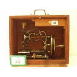 Boxed Raymonds chainstitch improved sewing machine, circa 1880…