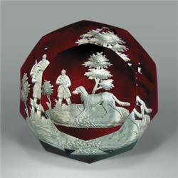 Antique Baccarat sulphide footed paperweight, with a landscape scene of a hunter and his dog in...