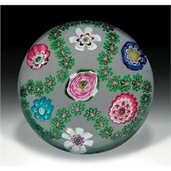 Rare antique Clichy Rose and garland paperweight, with a trefoil garland of green and red millefi...