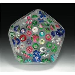 Antique Clichy scattered millefiori paperweight, with a central pink and green Clichy rose, surr...