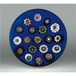 Antique Baccarat spaced millefiori on colorground paperweight, with assorted complex canes in re...