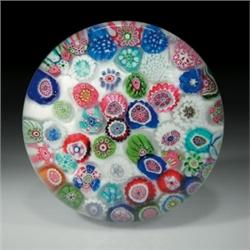 Antique Clichy scattered millefiori paperweight, with complex canes in shades of blue, pink, red...