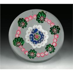 Antique Clichy open concentric millefiori paperweight, with a central pink and green Clichy rose...