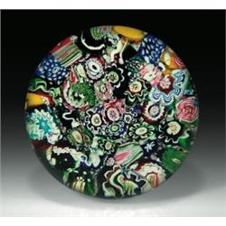 Antique Clichy scrambled millefiori paperweight, with whole and partial complex millefiori in blu...