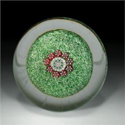 Antique Saint Louis millefiori paperweight, with a white, green, and red complex star cane center...