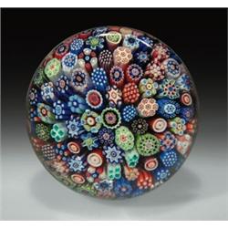 Antique Baccarat miniature close packed millefiori paperweight, with an assortment of colorful co...