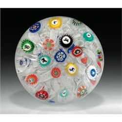 Antique Baccarat 1848 scattered millefiori paperweight, with assorted complex canes, including a...