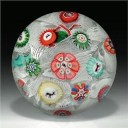 Antique Baccarat 1848 spaced complex millefiori paperweight, with Gridel silhouettes, including a...
