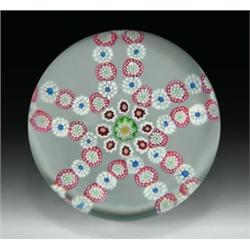 Antique Baccarat cinquefoil garland paperweight, in a star-shaped design of red, white, and blue...