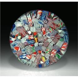 Antique Baccarat scrambled millefiori and filigree paperweight, containing a single cobalt blue a...