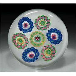 Antique Baccarat Dupont circular garlands paperweight, with a central green and red complex cane...