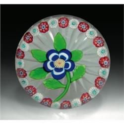 Antique Baccarat primrose and garland paperweight, with a cobalt blue and white flower, having a...