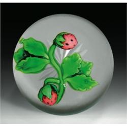 Antique Baccarat strawberry paperweight, with a pair of pink strawberries, growing on stems with...