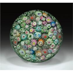 Antique Bohemian close packed millefiori paperweight, with a central blue and white complex cane...