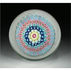 Antique English concentric millefiori footed paperweight, with a red, white, and yellow cane cen...