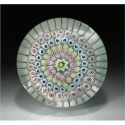 Antique English concentric high-domed millefiori paperweight, with a white and chartreuse cane ce...