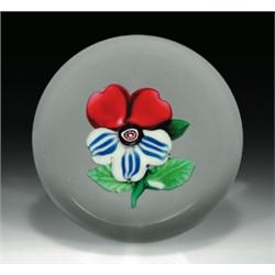 Antique Sandwich Glass Company pansy paperweight, with a central flower having two pink-tipped,...