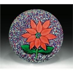 Antique Sandwich Glass Company poinsettia paperweight, with a double-tiered salmon-colored poins...