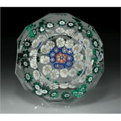 Antique New England Glass Company faceted concentric millefiori paperweight, containing three rin...