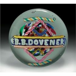 Antique American souvenir frit paperweight, displaying the name, "EB. B. DOVENER," printed in th...