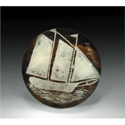 Antique American sailing ship frit paperweight, containing a white ship with three sails in a ca...