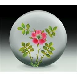 Paul Stankard floral rose paperweight, with a centrally placed single pink wild rose, having upr...