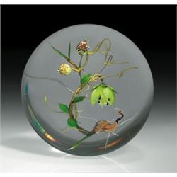 Paul Stankard floral paperweight, composed of a kiwi green-yellow, five-petal flower with black-t...