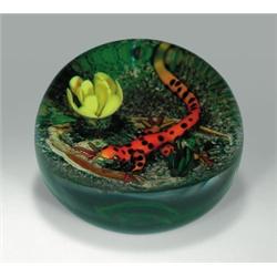 Delmo Tarsitano salamander paperweight, with a bright orange and black-spotted salamander, betwee...